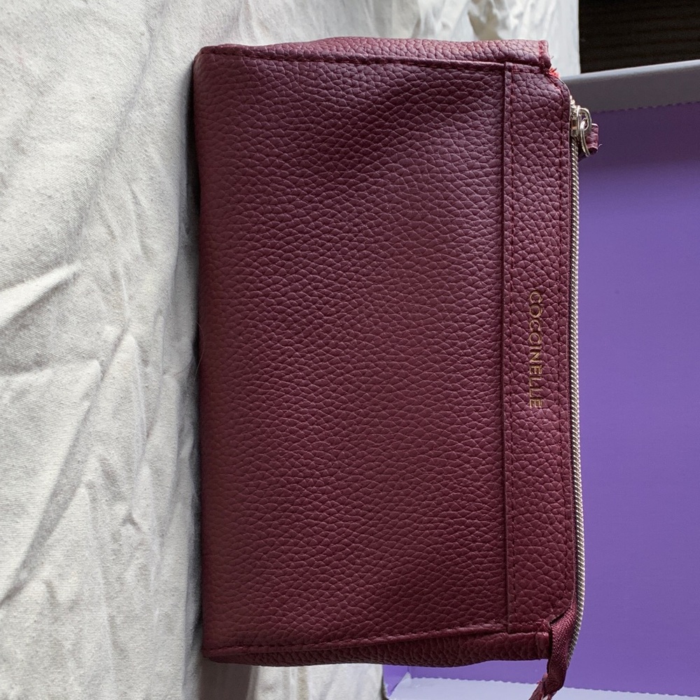 Coccinelle Plum Leather toiletry bag